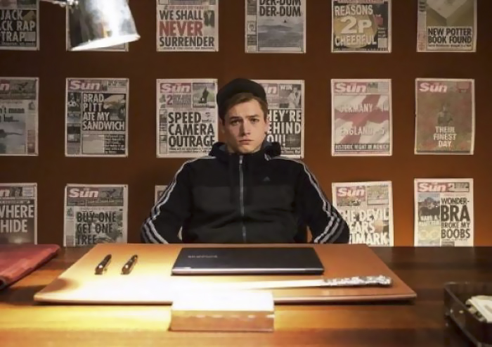 The Newspaper Wall In Agent Galahad's Office In Kingsman: The Secret Service Includes The Headline 'Brad Pitt Ate My Sandwich'