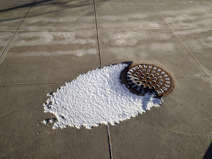 It's So Cold That The Steam From The Sewer Grate Turns Into Snow