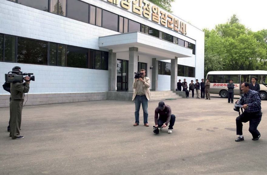 Only In North Korea: I Was At A Factory Shooting With My Tv Crew. We Were Followed By A Local Cameraman Who Filmed Throughout The Trip (On The Right). On This Day, The Government Sent Another Cameraman To Film Us All! Very Meta