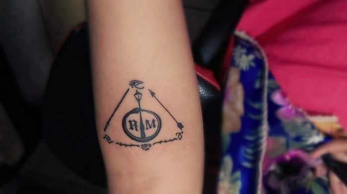 My Fandom Tattoo = Lamppost - Narnia Ouroborus - X Files (Scully Had A Tattoo Like This); Rose N Thorns - The Arcana Chronicles; Antarian Royal Seal - Roswell; Angel Power Rune - The Mortal Instruments; Light Saber - Star Wars; Arrow - The Walking Dead; Wedjat - Egyptian Mythology; R - Dark Matter (Scifi Show Which Has A Space Ship Called Raza); M - The Originals (The Leads Have The Surname Mikaelson); And The Whole Together Forms: The Deathly Hallows - Harry Potter.