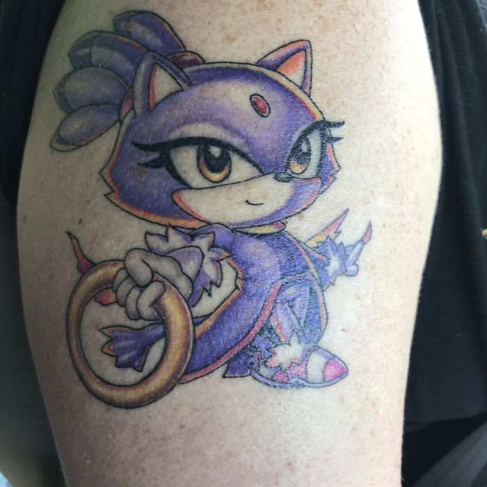 For Our 5 Year Wedding Anniversary I Got Blaze The Cat Tattoos On Me Holding A Ring, My Husband Got Sonic Holding A Ring And When You Put Them Together It Looks Like That Are Holding The Same Ring