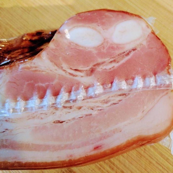 Slice of ham with a pattern resembling a face, illustrating an accidental cosplay effect.