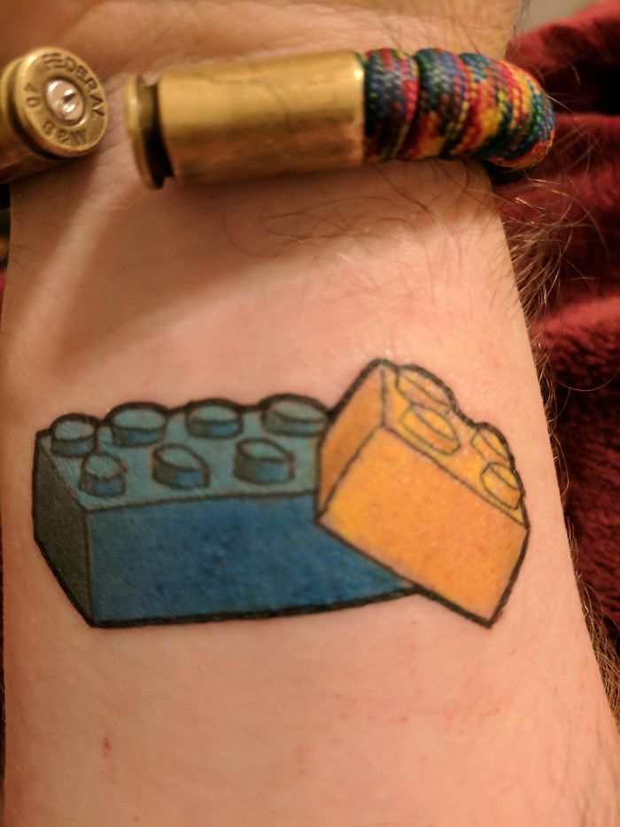 My First Tattoo. The Big Brick Is To Represent My Big Brother Who Died One Day Shy Of His 40th Birthday This Year, In His Favorite Color, And The Little One (Hugging The Larger One) Represents Me, In My Favorite Color. We Always Built Lego Together