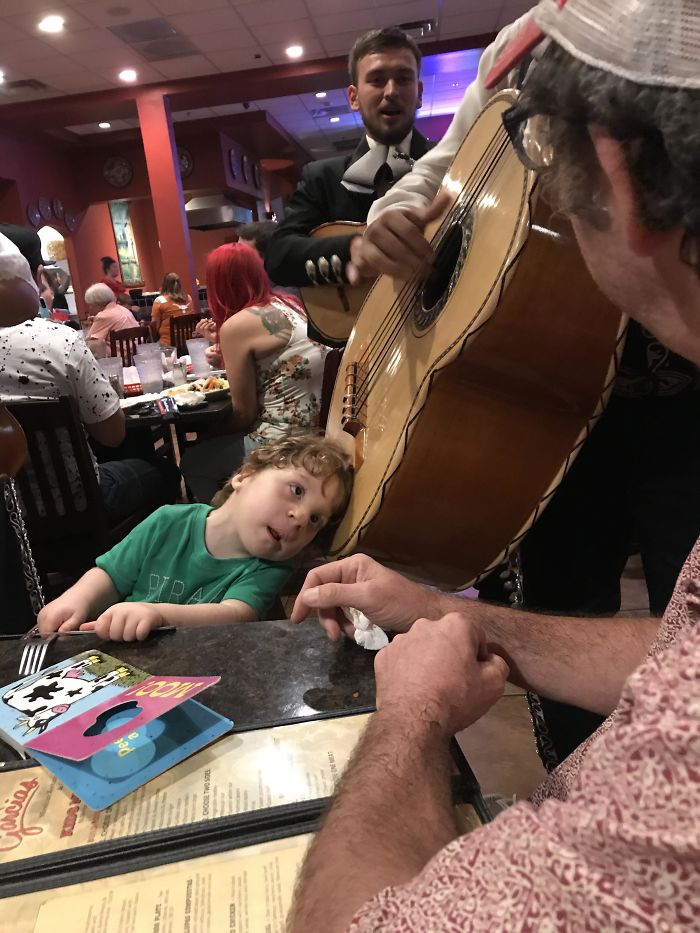 A Mariachi Musician Let My Hard Of Hearing Son Put His Head On The Guitarron So He Could Hear It. He Was Amazed!