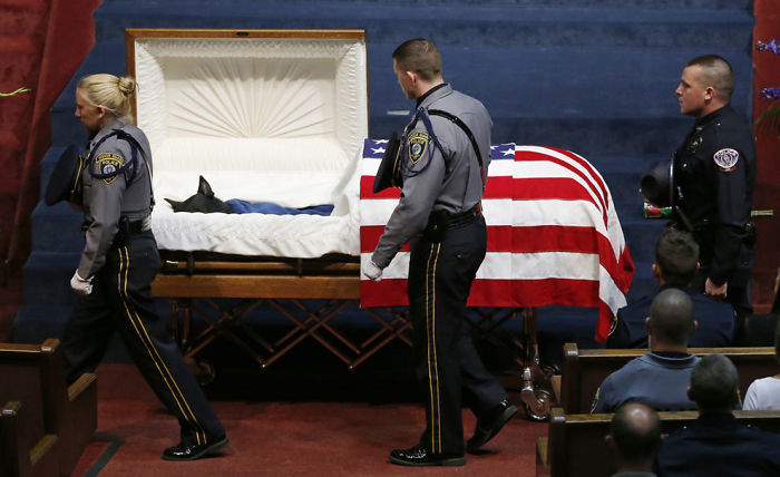 Police Officers File Past The Casket Of Oklahoma City Police Canine Officer K-9 Kye During Funeral Services In Oklahoma City On August 28, 2014. K-9 Kye Died On August 25 After Being Stabbed By A Burglary Suspect On August 24