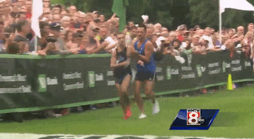 First Place Runner Collapses 50m Shy Of Finish Line, Helped Across By Second Place Runner