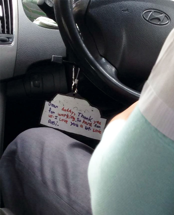 A Note Hanging From This Taxi Driver's Steering Wheel