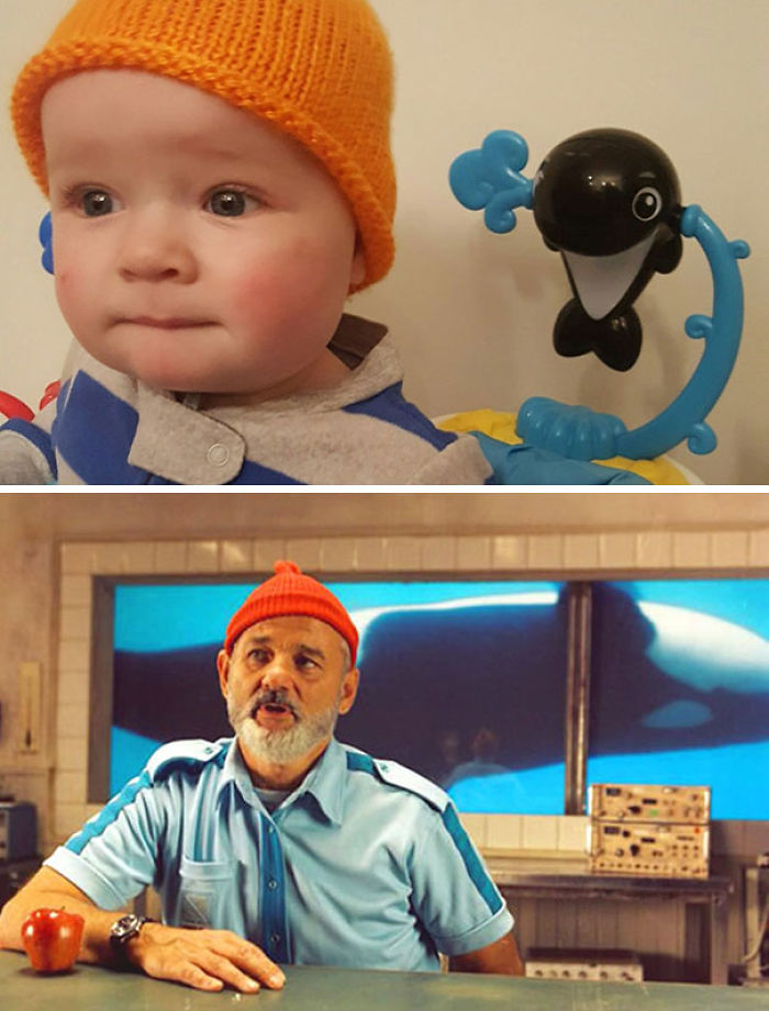Baby in an orange hat and striped outfit resembling a movie character, embodying accidental cosplay.