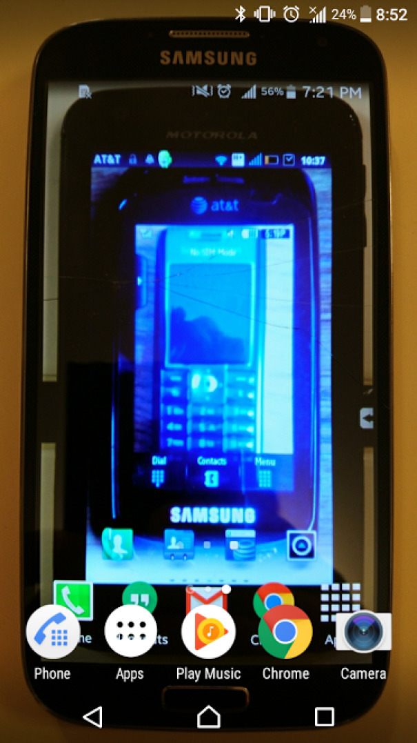 "Phoneception" - Whenever I Upgrade My Phone I Snap A Pic Of The Old Phone With This Photo As The Background. I Find It Pretty Amusing But My Wife Hates It