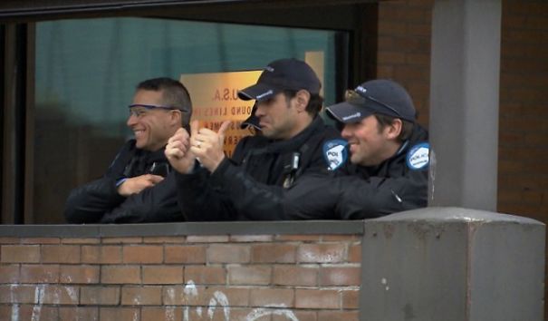 Students In Montreal Protested Rising Tuition By Going (Nearly) Naked. Here's A Pic Of Some Montreal Police "Observing" The Protests