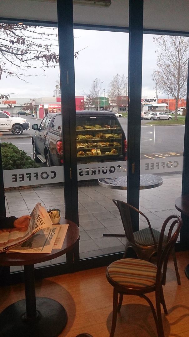 Mirage Of Coffee Shop Window Makes It Look Like This Car Sells Pies Out Of The Boot