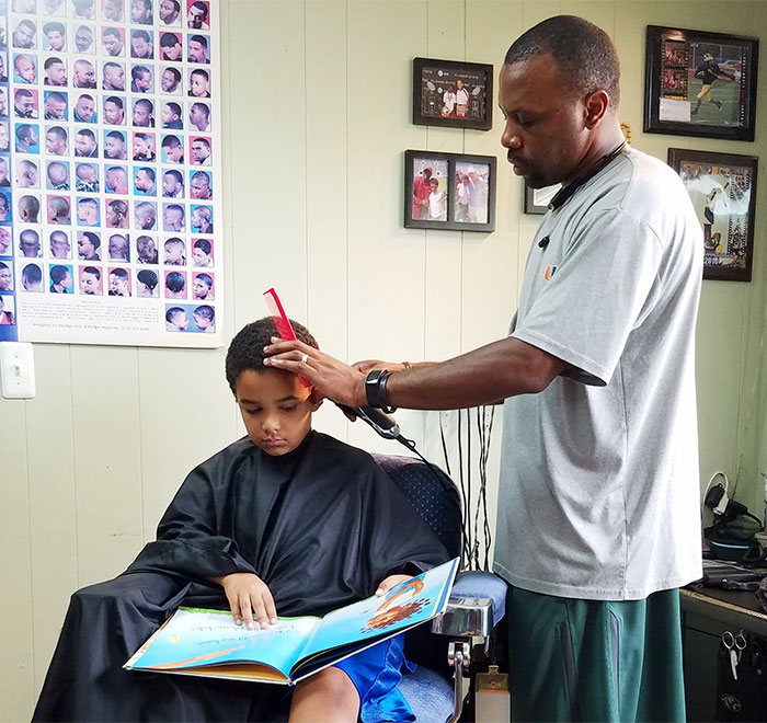 Kids Get A $2 Discount If They Read A Book Aloud To This Barber In Michigan