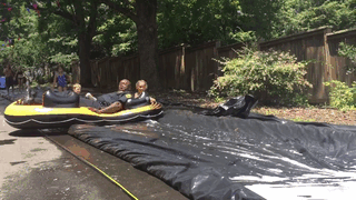 On The 4th Of July, Police In Asheville, NC, Got A Call About A Giant Slip’n Slide Supposedly Blocking The Road. But When The Cops Arrived, Instead Of Shutting It Down, They Joined In
