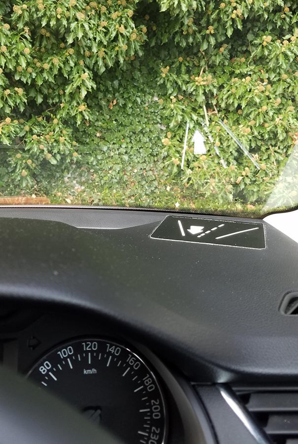 Rental Car In Ireland Has Dashboard Sticker That Reflects In The Windshield To Remind You What Side Of The Road To Drive On