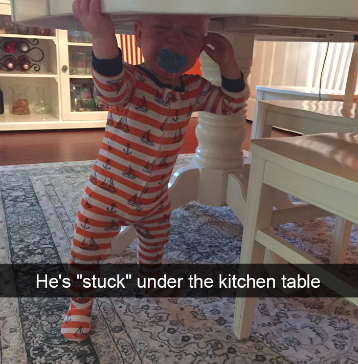 He's "Stuck" Under The Kitchen Table