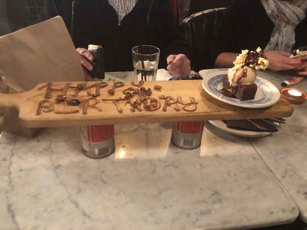 It’s My Birthday Today And Someone Told The Restaurant. Birthday Brownie Technically Came On A Plate, However Said Plate Was Placed On A Board Propped Up By Two Tomato Cans