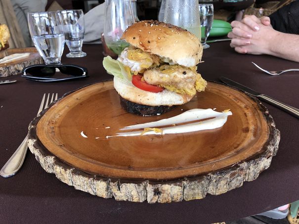 In Belize, My Burger Arrived On A Tiny Wooden Disc On Top Of Another Wooden Slab