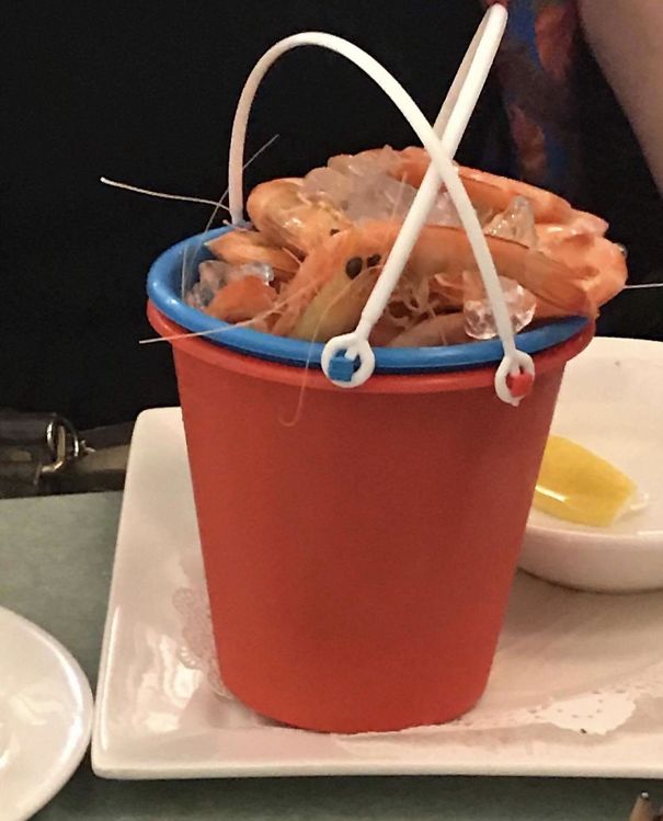 Prawns In A Child’s Beach Bucket. On A Plate