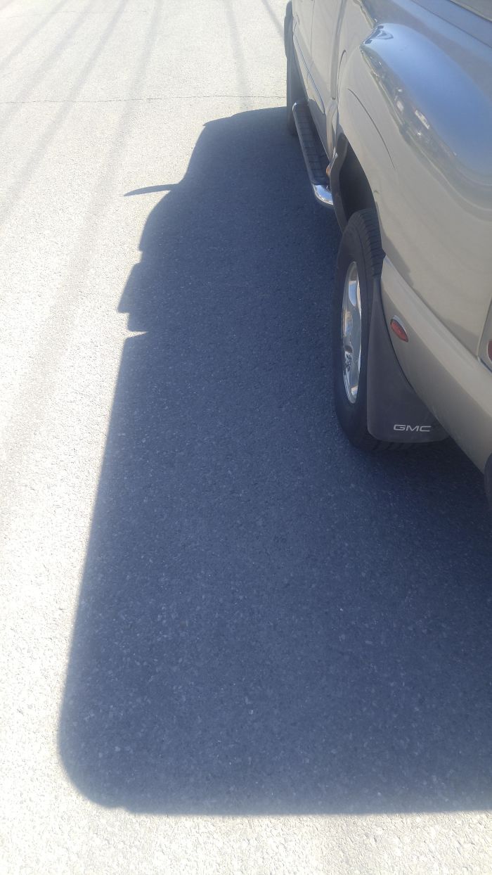 This Car's Shadow Looks Like A Happy Cowboy With A Giant Chin