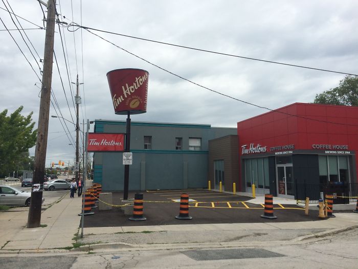 This Tim Hortons Turned An Old KFC Bucket Sign Into A Giant Coffee Cup