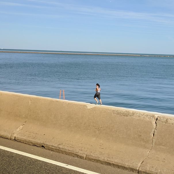 Tiny Jogger Spotted On Freeway Barrier