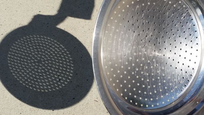 Shadow Of A Strainer During Partial Solar Eclipse