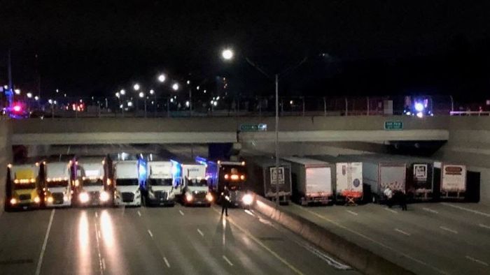 13 Truck Drivers Park Side-By-Side Under A Bridge To Stop Man From Committing Suicide