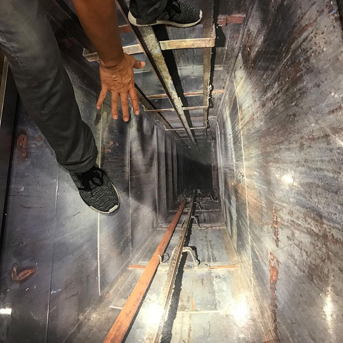 Hanging On To Dear Life On The Elevator Shaft