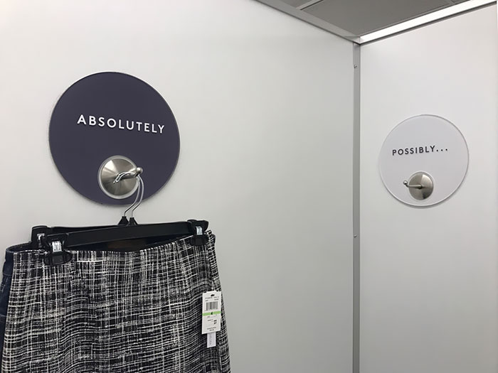 This Dressing Room Has Their Clothing Hooks Labeled In A Very Minimalist Way