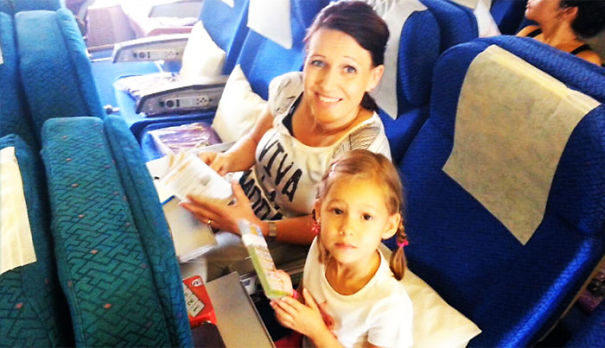 Picture of Dave Hally wife with daughter on the plane