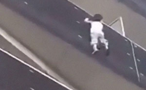 African Immigrant Climbs 4 Storeys With His Bare Hands In Less Than 30 Secs To Save 4-Year-Old Dangling From Balcony
