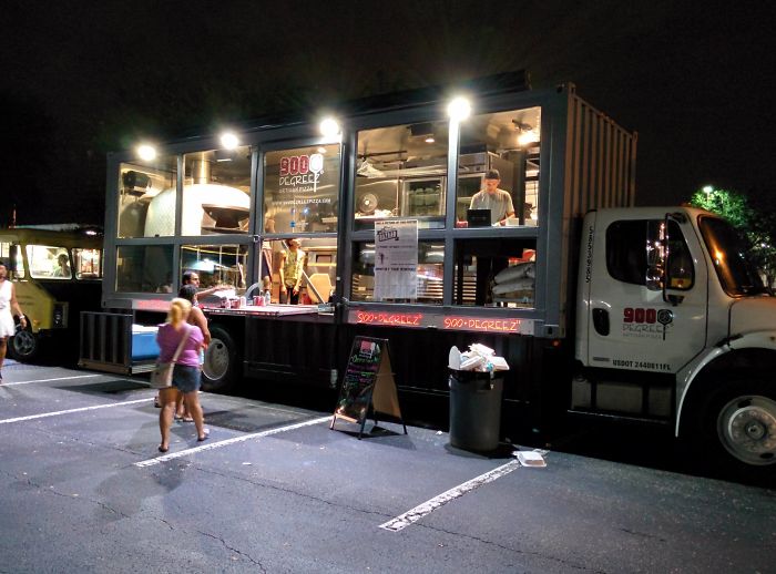 Next Level Food Truck: Pizza Parlor Inside A 35 Foot Storage Truck Containing A 3500 Pound Italian Wood-Fired Oven That Cooks Pizza In 90 Seconds. A Stairwell Leads To The Recessed Point Of Sale Area