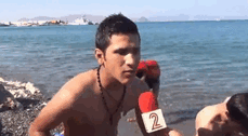 Kid In Background Of News Report Gets Stuck In His Lifejacket