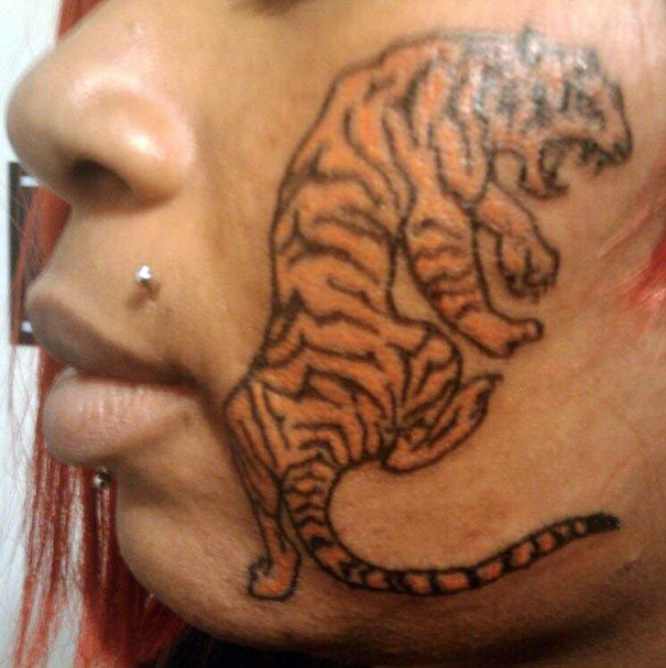 Tiger tattoo on woman's face