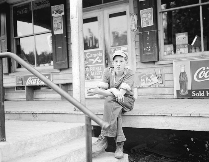 Boy On Porch Of General Store, Roseland, Virginia, 1938