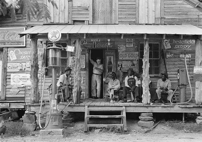 Country Store On Dirt Road. Note The Kerosene Pump On The Right And The Gasoline Pump On The Left. Brother Of Store Owner Stands In Doorway. Gordonton, North Carolina, 1939