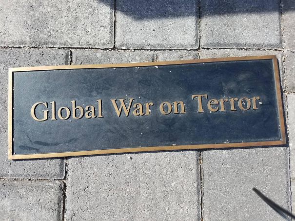 The Way This Plaque Was Set In Front Of A War Memorial