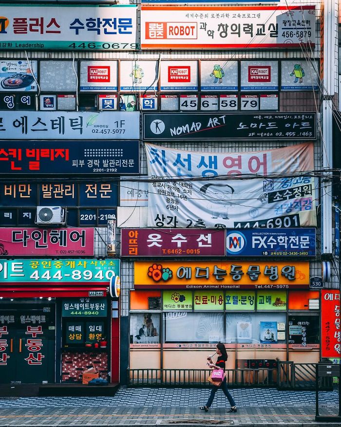 Colorful storefront signs in Seoul showcasing local businesses, captured by an English teacher who moved from the US.