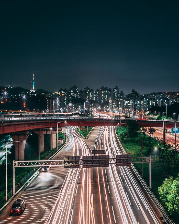 Night view of Seoul cityscape with busy highways and light trails captured by an English teacher living in Seoul.