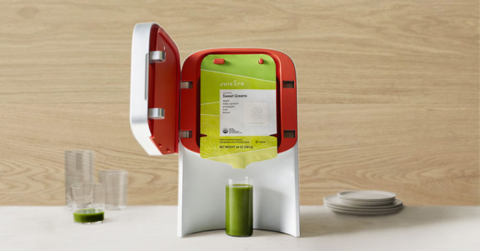 Picture of Juicero with glass of juices