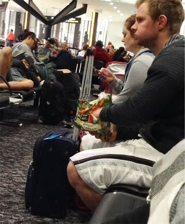 Melbourne International Airport 2:30 AM. This Guy. Eating A Bag Of McCains Frozen Vegetables