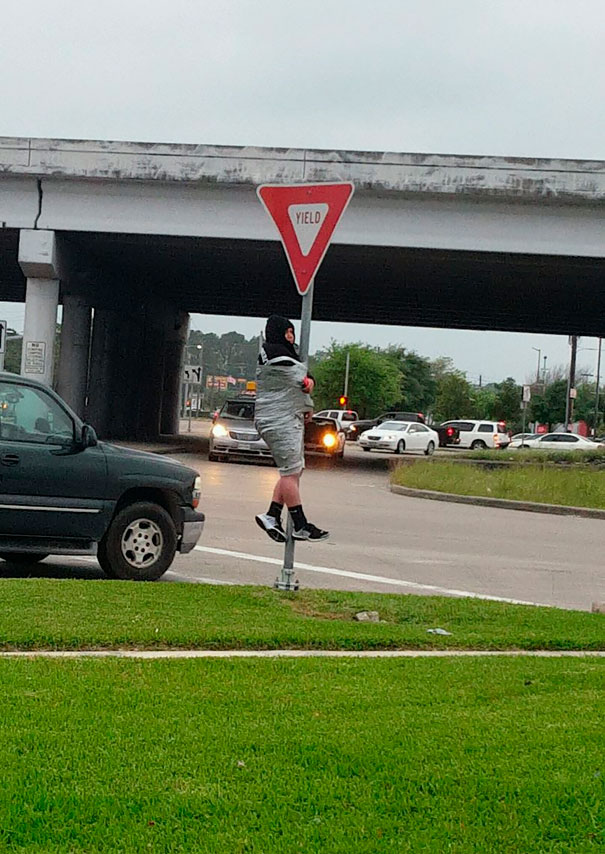 This Guy Lost A Bet And Now Is Stuck To The Yield Sign On Wallisville