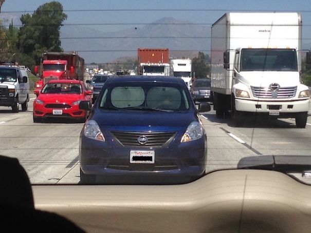 Man Driving With Sun Shades On Freeway