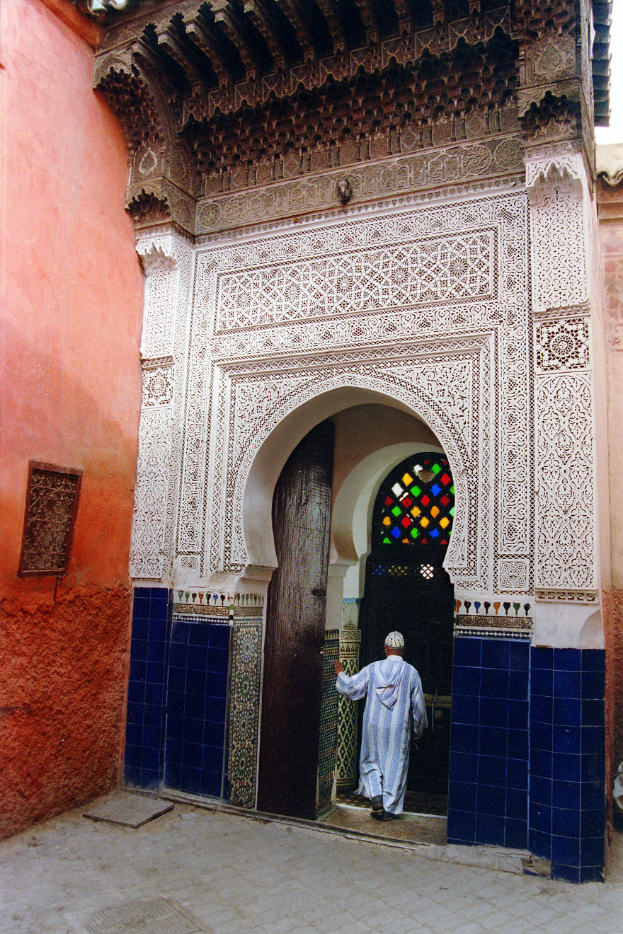 The Marrakech Medina Is Full Of Architectural Wonders. A Man Enters The Mausoleum Of Sidi Abdel Aziz
