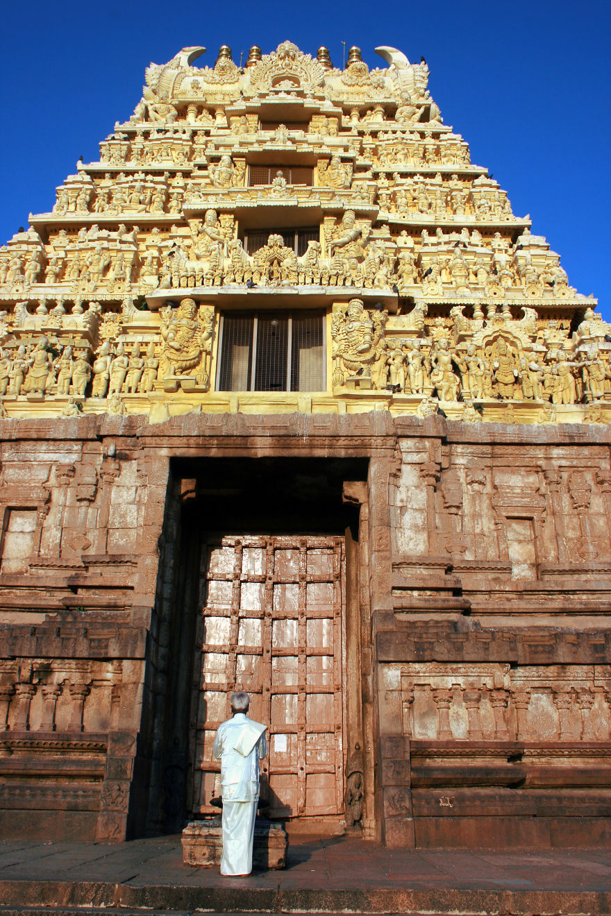 A Man Prays At Dawn In Front Of The Chennakesava Temple, Belur, India