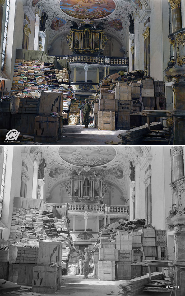 A US Soldier Stands Amid Crates And Stacks Of Loot Stored By Nazi Germany In Schlosskirche (Castle Church), Bavaria, 1945