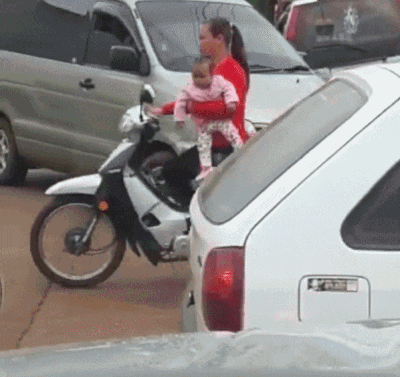 Riding A Motorbike While Holding A Baby Is A Bad Idea