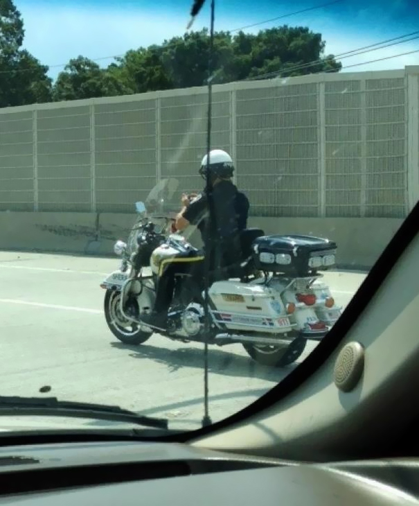 My Friend Took This Yesterday. Yes, That Is A Police Officer Texting While Driving A Motorcycle