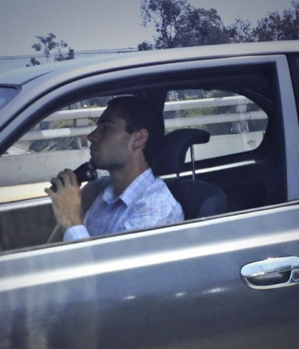 This Guy Is Shaving While Driving