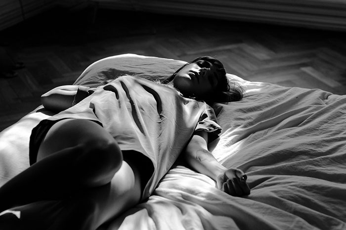 Black and white image of sleeping woman